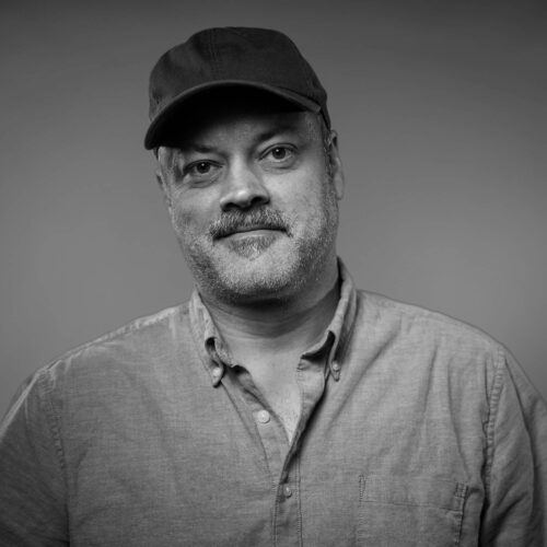 portrait of man with a hat smiling