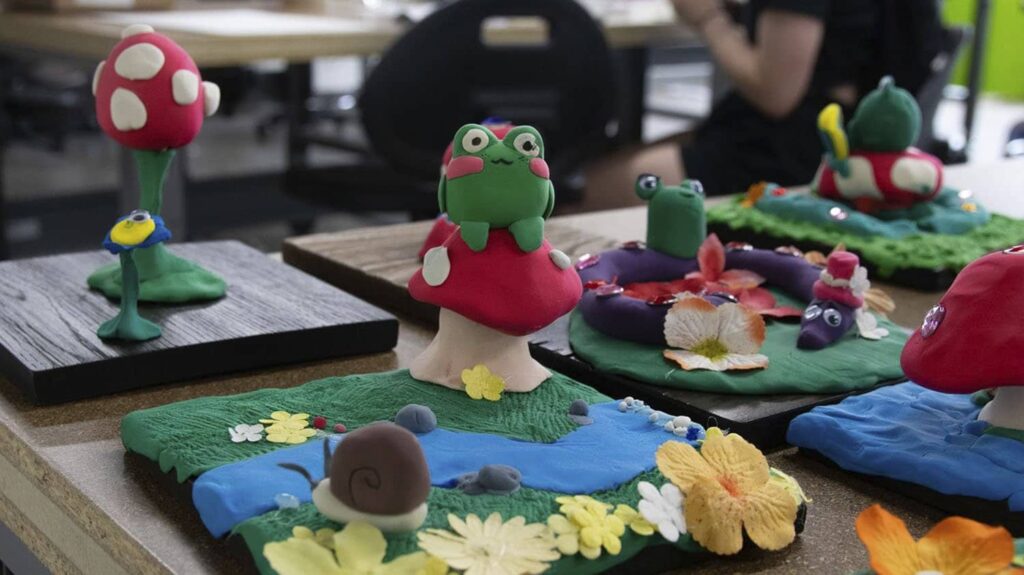 clay sculpted frogs and mushrooms