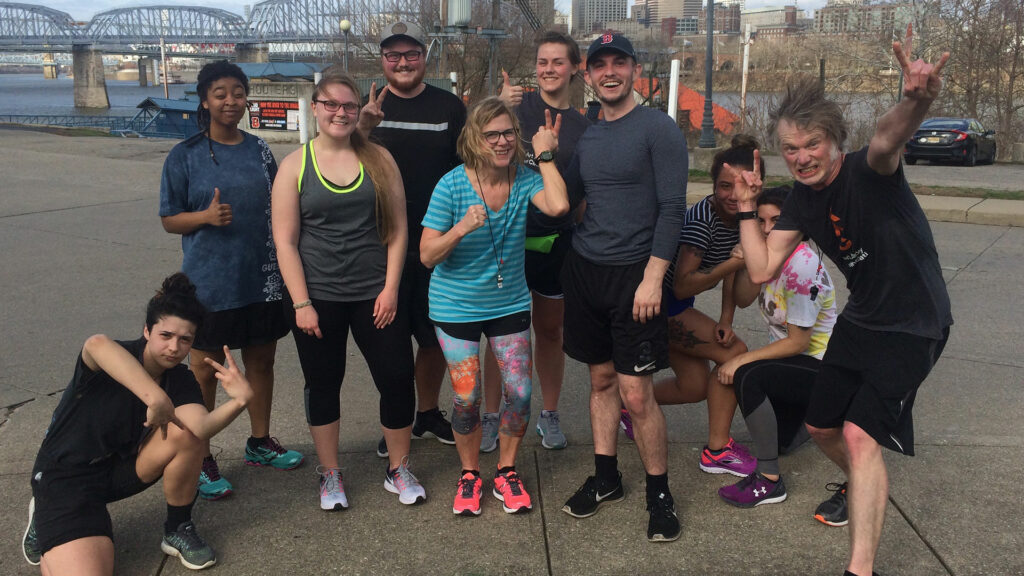 group of students and faculty at the levee