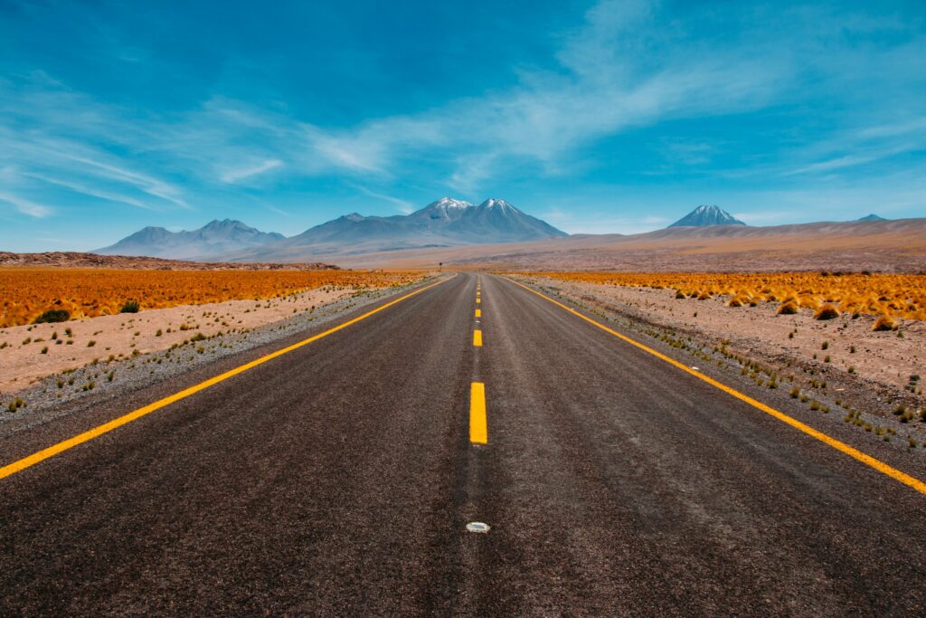 desolate road looking at mountains