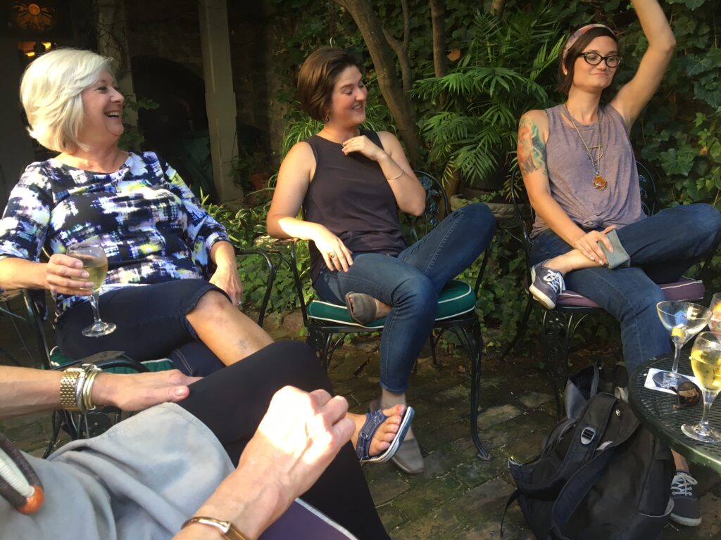 four women at alumni happy hour outside