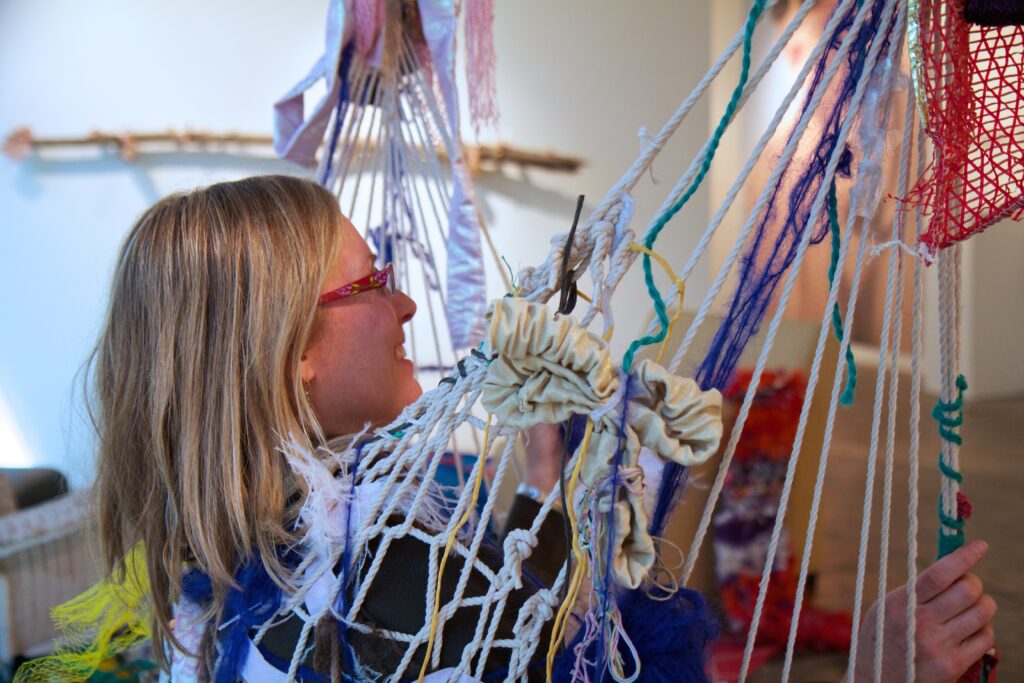 woman in net chair