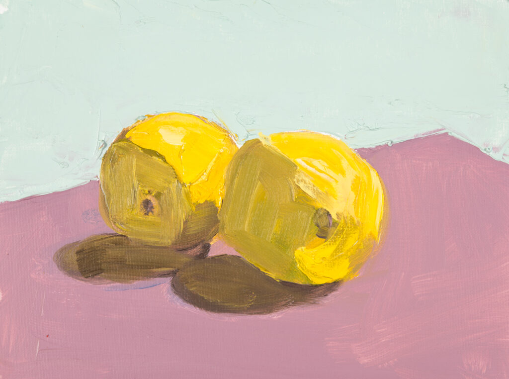 painting of lemons on pink table