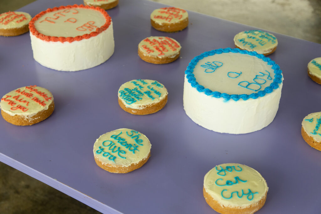 sculptures of cakes with writing icing