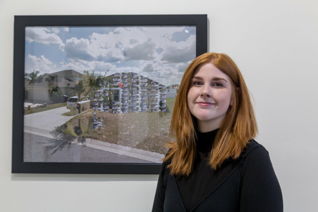 student posing in front of framed digital collage