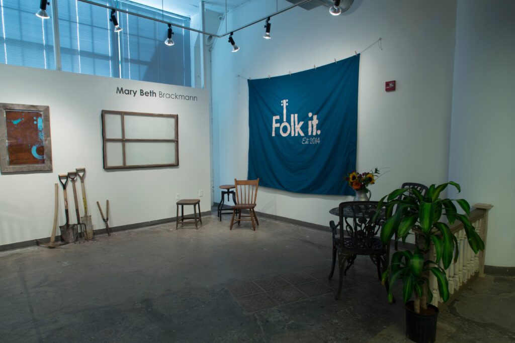 pop-up shop with large textile banner reading "folk it"