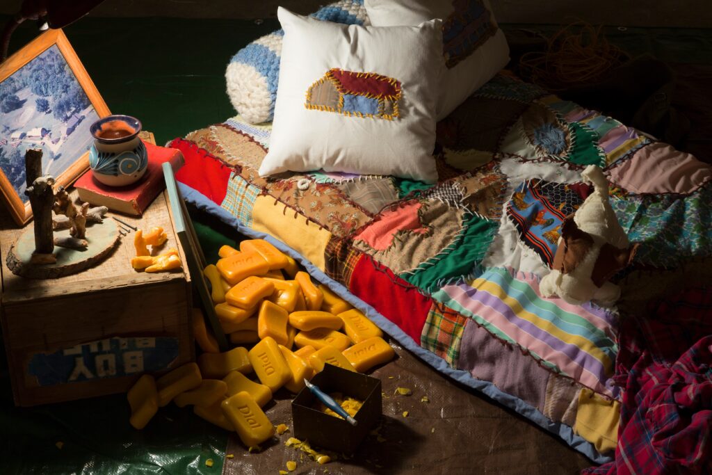 handmade textile bed sculpture near dim light