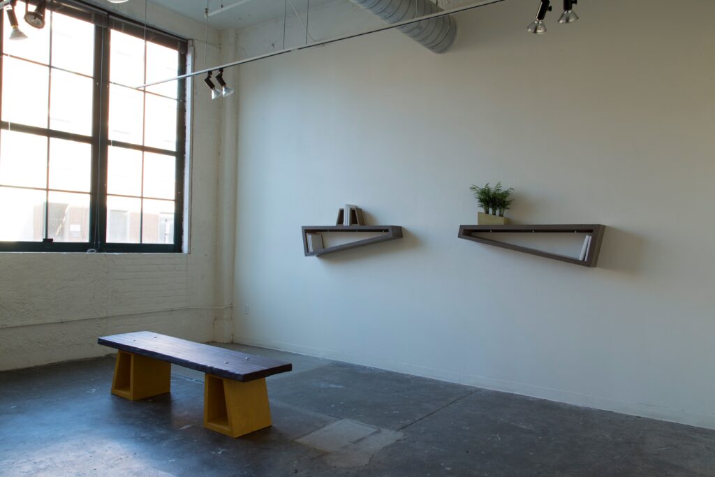 geometric bench and shelves in gallery