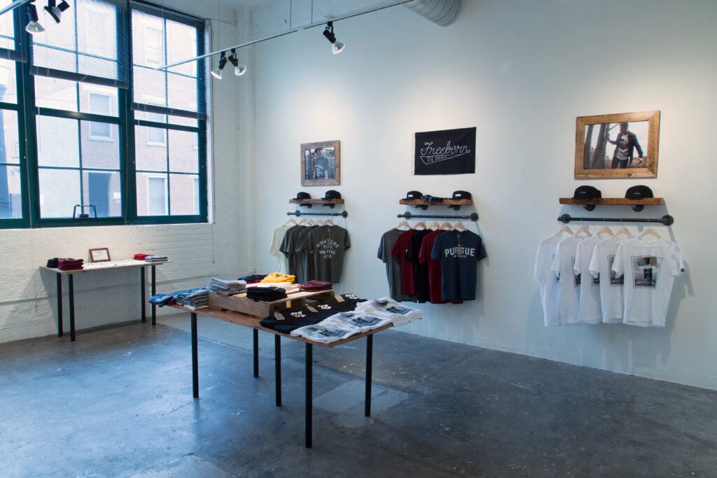 pop-up shop with shirts in gallery