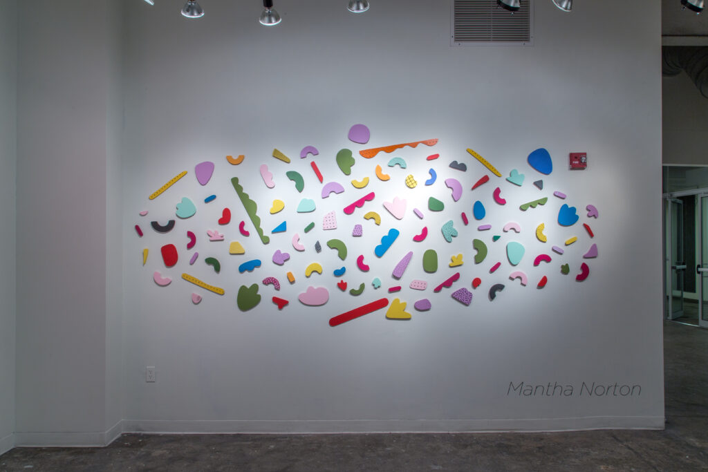 installation of painted shape wall sculptures