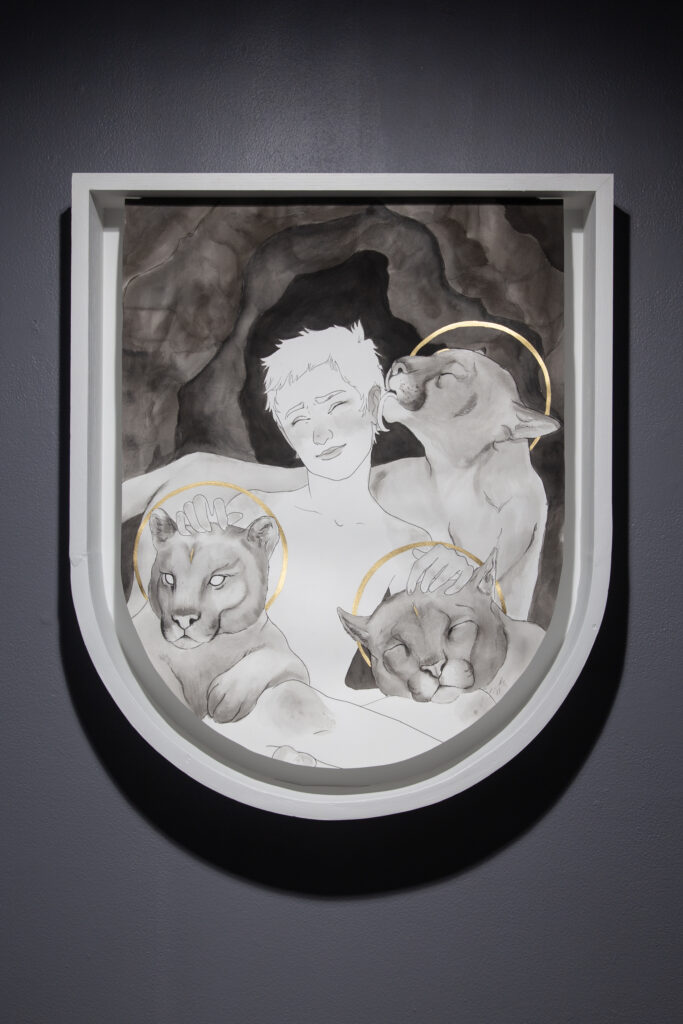 black and white crest shaped illustration of figure with lions smiling