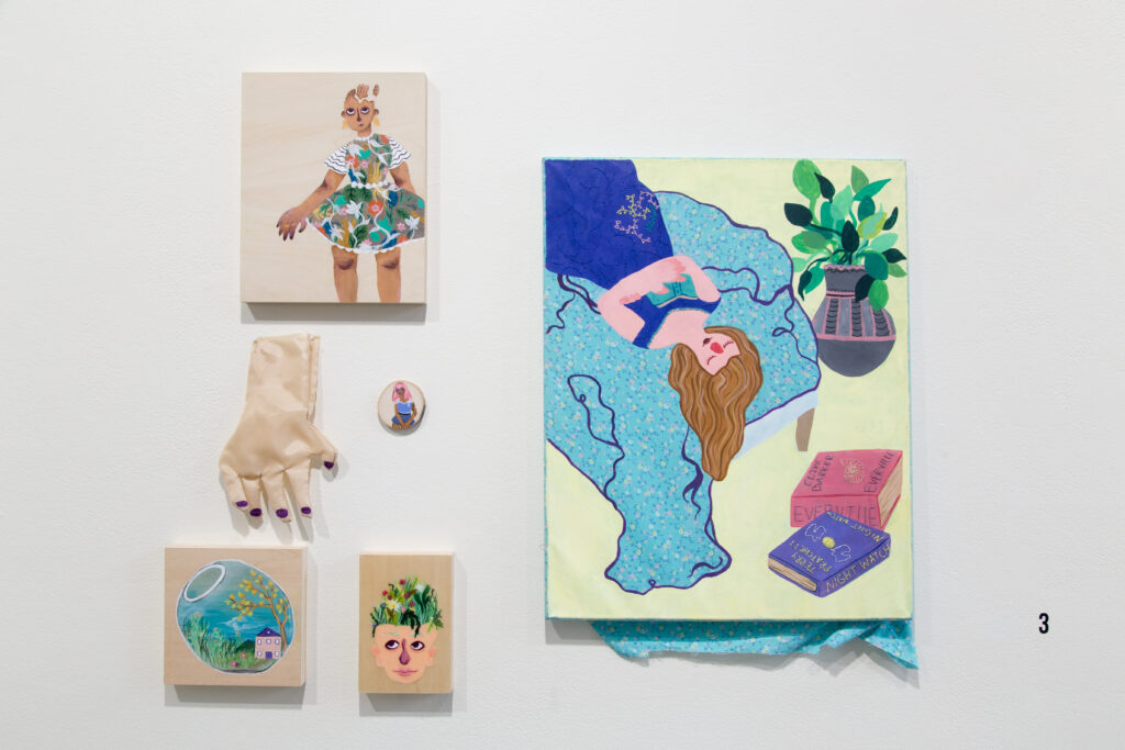 wall collage of illustrations and gloves with colorful cartoonish figures