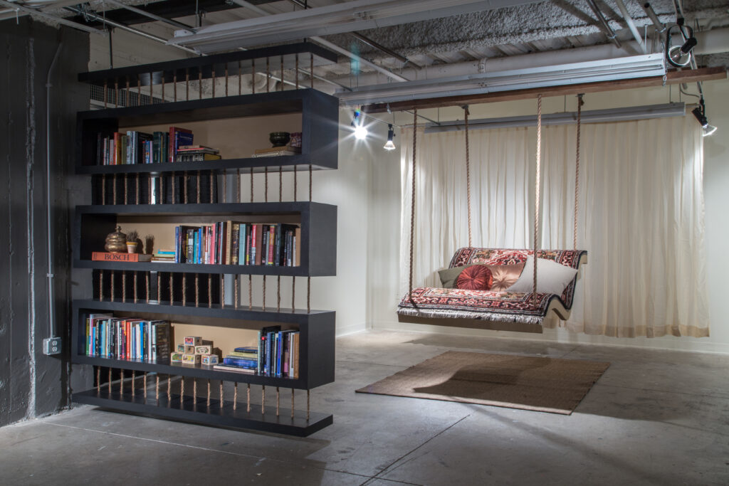 bookshelf and hanging carpet chair