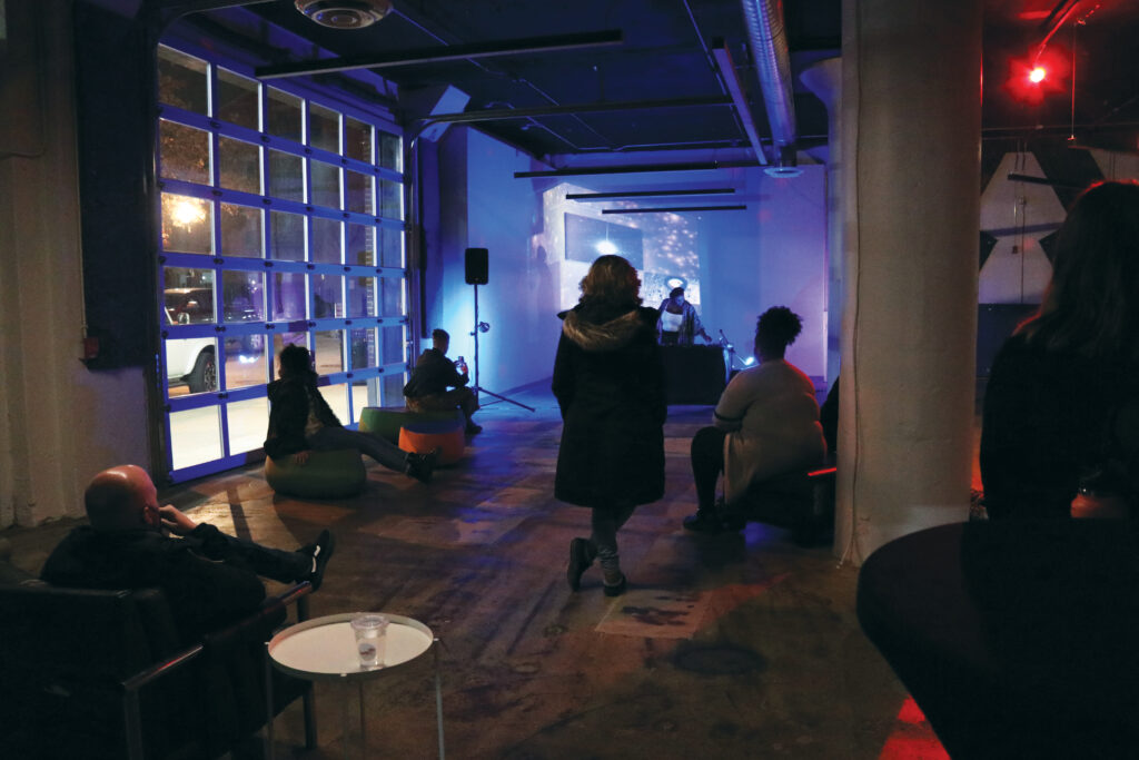 people watching audio video projection from Muse Dodd