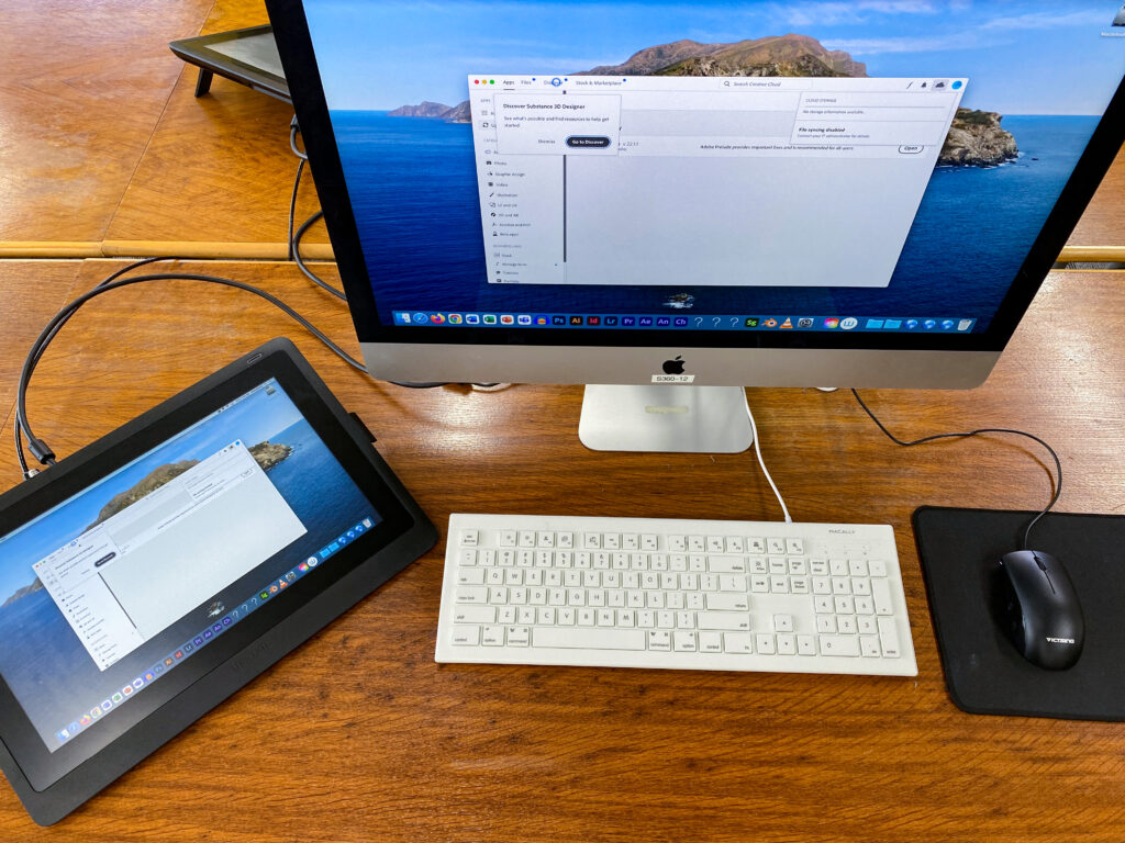 photo of a computer and drawing tablet