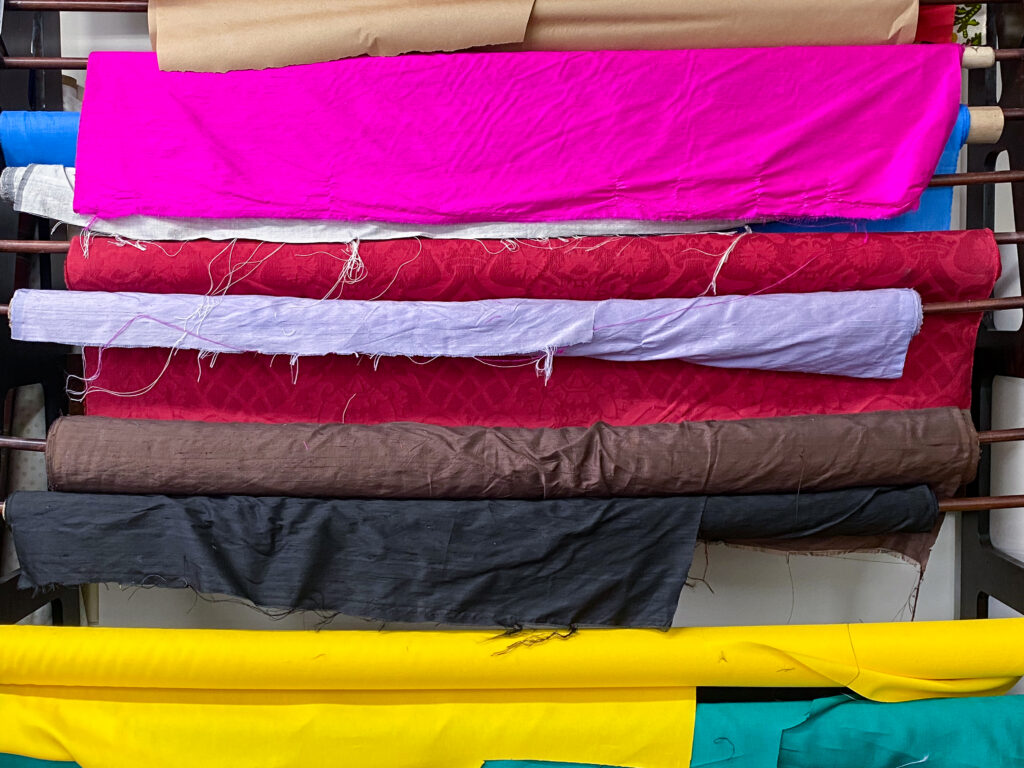 photo of rack of fabric rolls