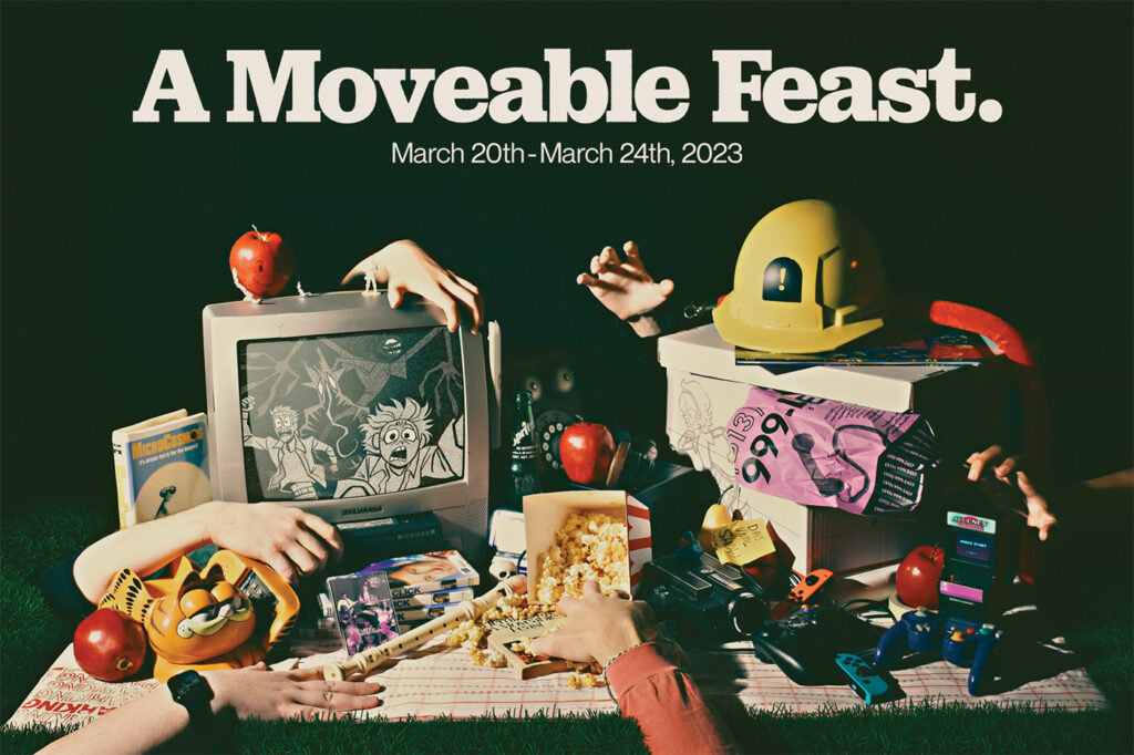 An image of a wide variety of objects laid out on a blanket, with hands reaching for certain objects, all in front of a dark background and the title "A Moveable Feast." above
