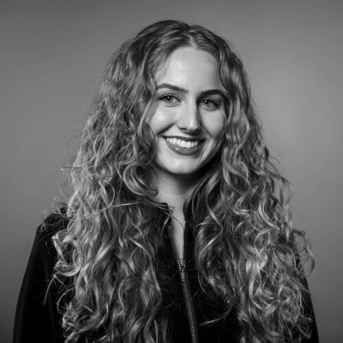 woman with long hair smiling