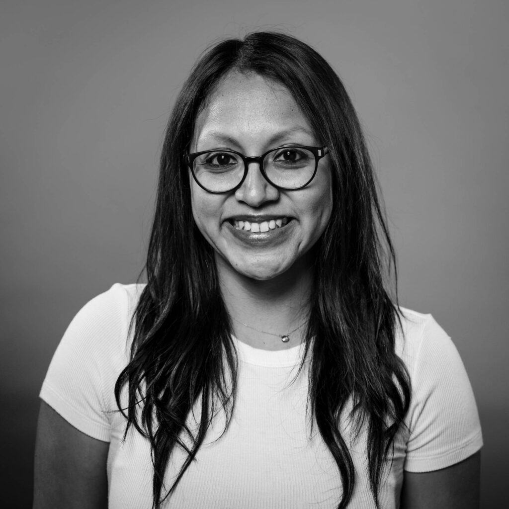 woman smiling with arms crossed