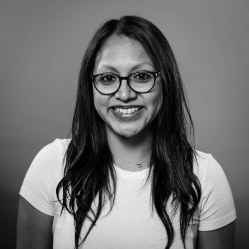 woman smiling with arms crossed