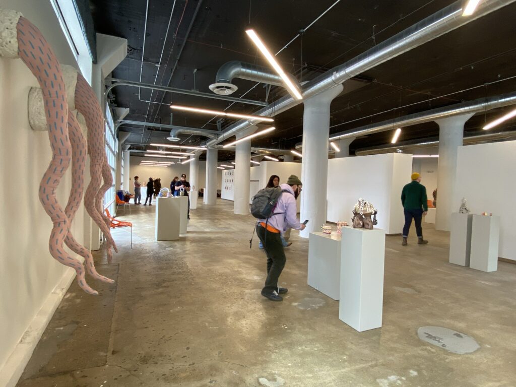 Visitors observe ceramics and artwork as part of the NCECA conference in SITE1212 at the Art Academy of Cincinnati.