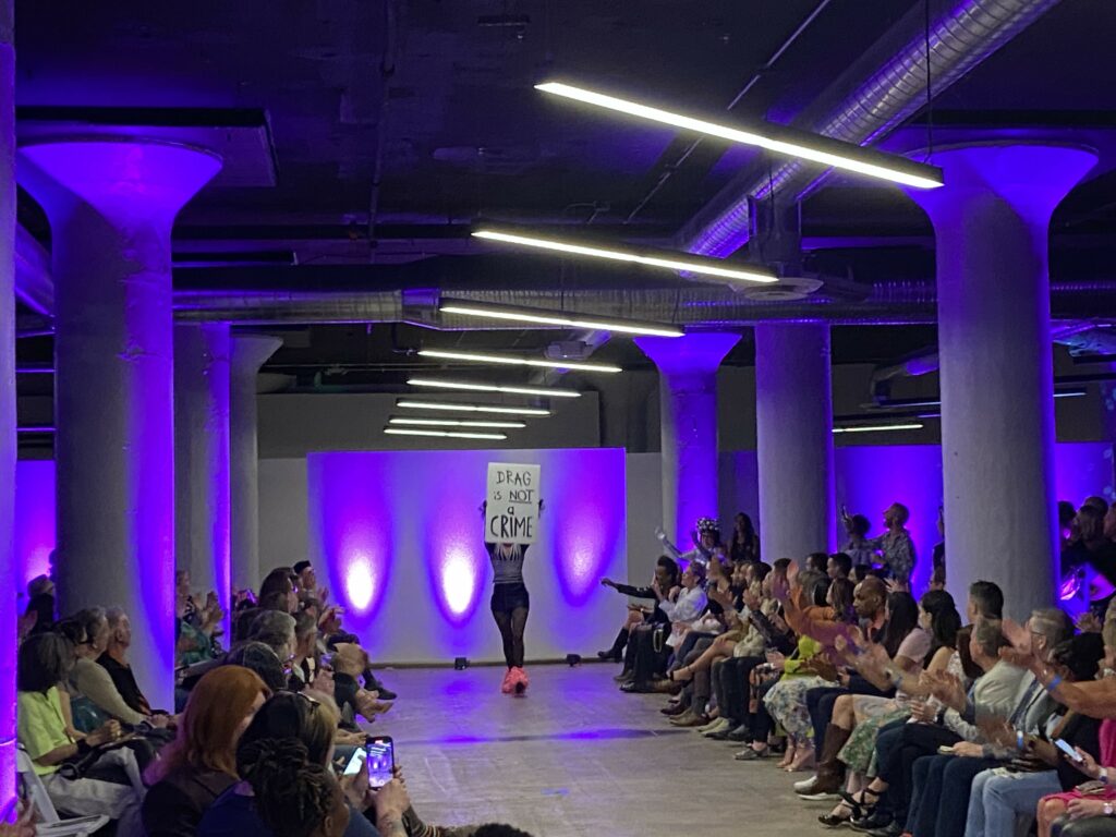 A model walks the runway in the HRC Project Rainbow Fashion Show in SITE1212 at the Art Academy of Cincinnati.