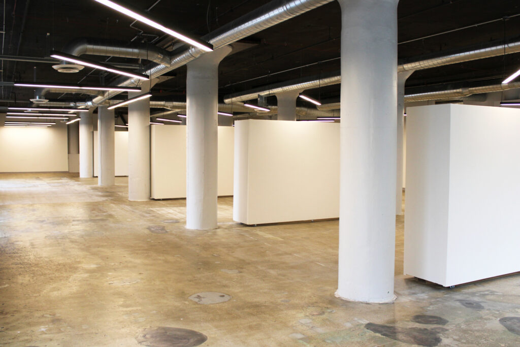 blank white walls and columns in site 1212 event space
