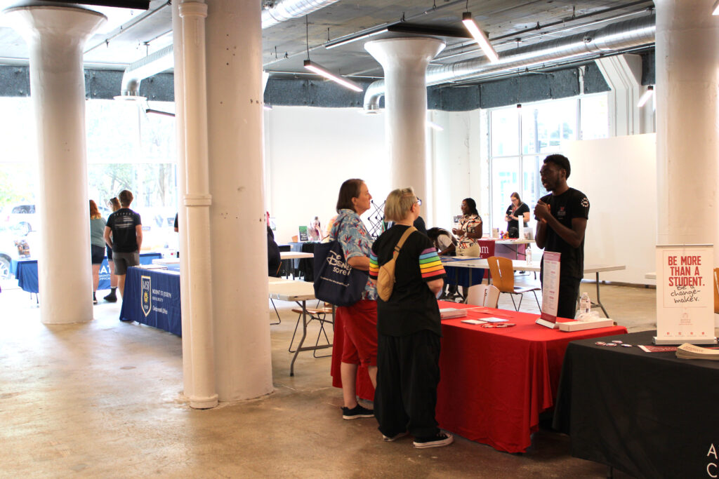 Students speak with prospective colleges at the Devonshire Smith College Fair in SITE1212 at the Art Academy of Cincinnati.