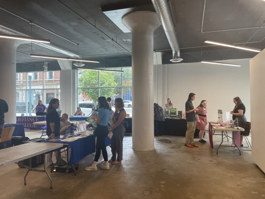 Students speak with prospective colleges at the Devonshire Smith College Fair in SITE1212 at the Art Academy of Cincinnati.