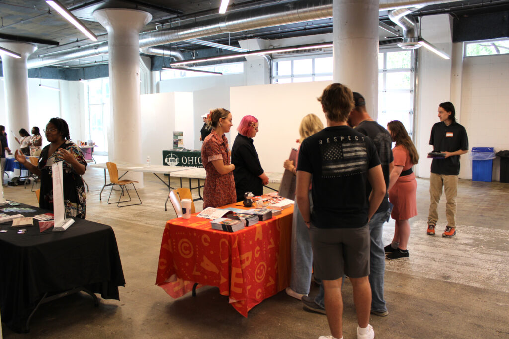 Students speak with prospective colleges at the Devonshire Smith College Fair in SITE1212 at the Art Academy of Cincinnati.