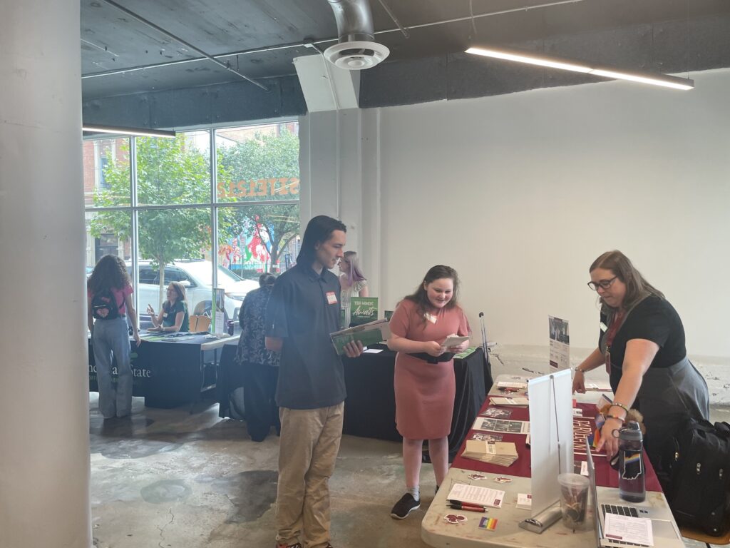 Students speak with prospective colleges at the Devonshire Smith College Fair in SITE1212 at the Art Academy of Cincinnati.