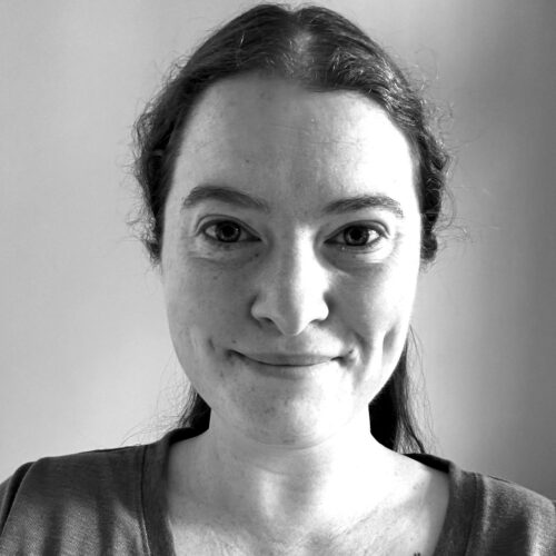 woman smiling as Title IX coordinator and director of student affairs, Grace Wohlschlegel