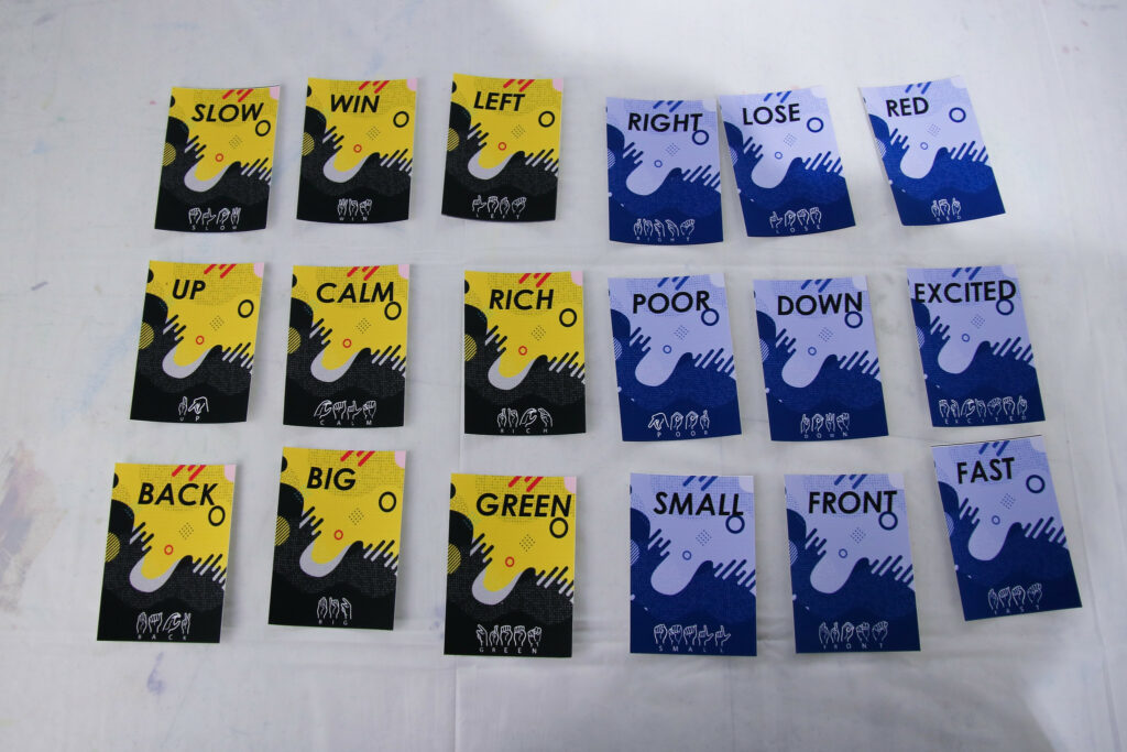 Several printed cards depicting various words