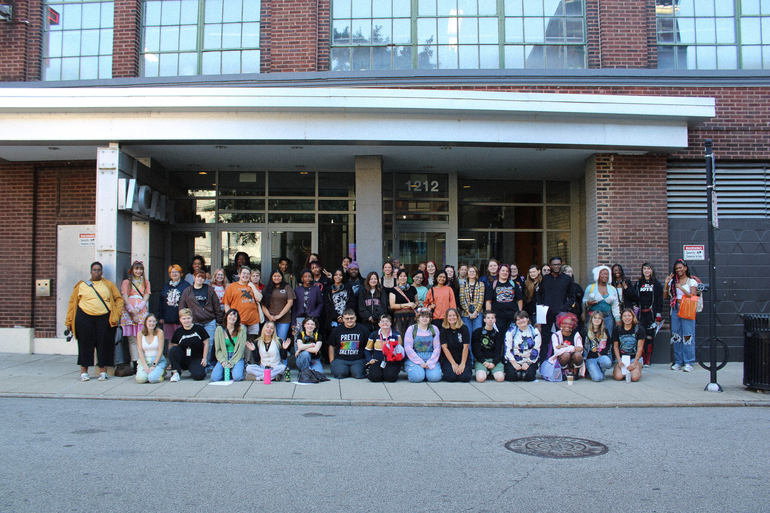 graduating seniors group photos outside the AAC building