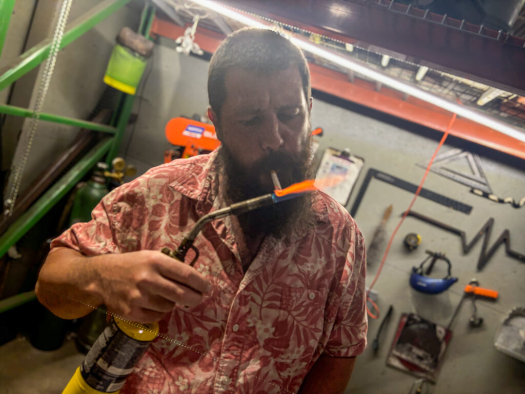 Jamie Payne Artist, Alumni Art Academy lights American Spirit with blowtorch
