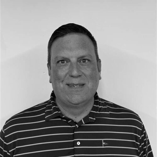man smiling in a striped shirt