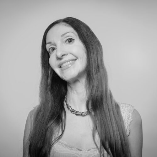 black and white photo of a woman smiling
