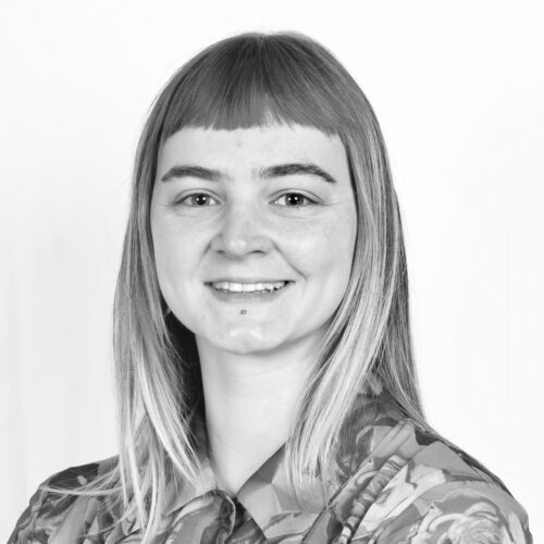 photo of Dana Schriever smiling in black and white