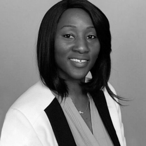 black white portrait of a woman smiling. Candace Fairer