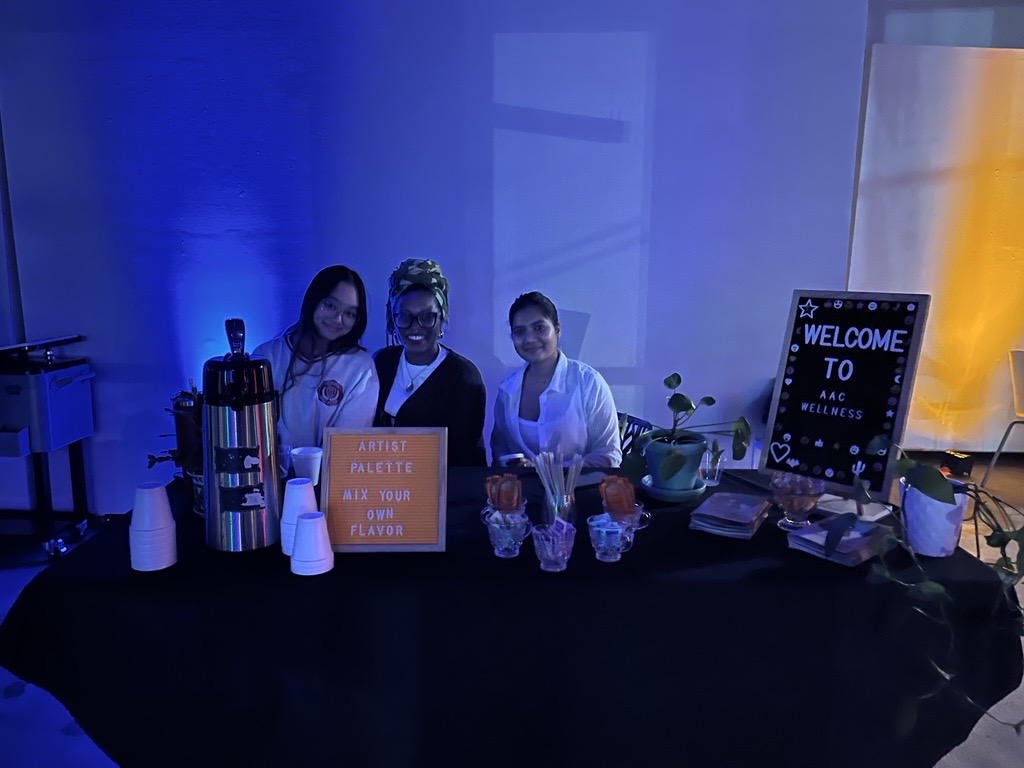 three student wellness ambassadors with blue lighting