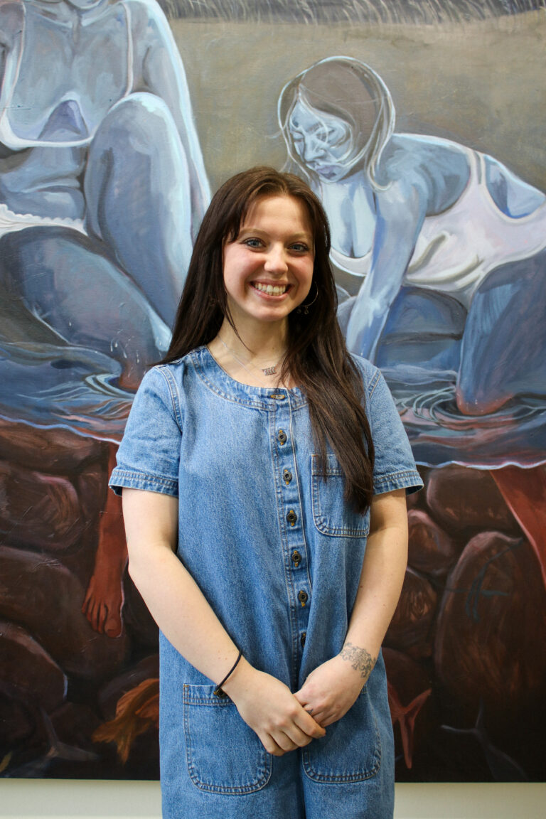 woman standing in front of painting Rory Torstensson