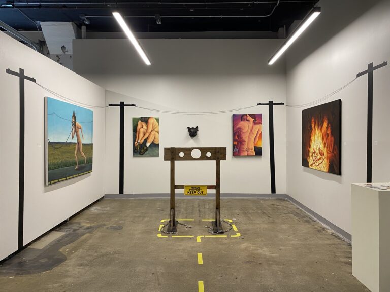 paintings and sculptures in a gallery