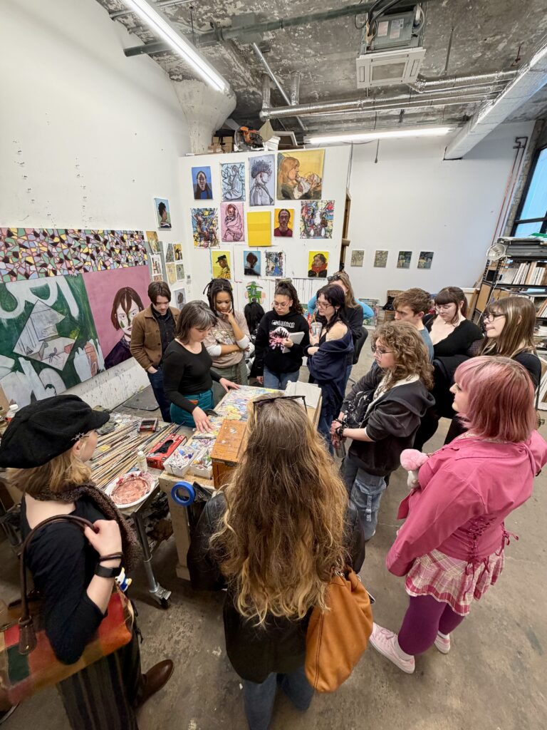 students looking at an artist's studio in New York