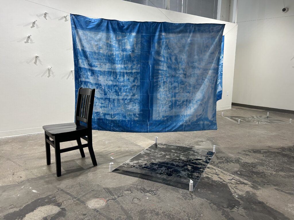 textile installation with chair in gallery by Tommy Ballard