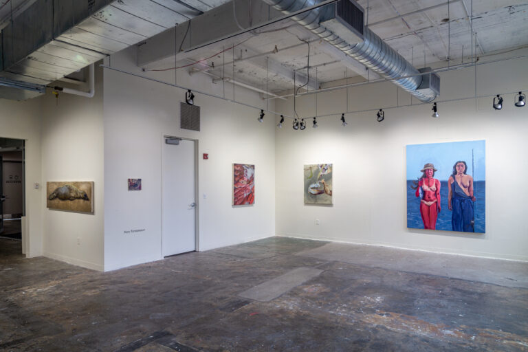 paintings hanging in a gallery